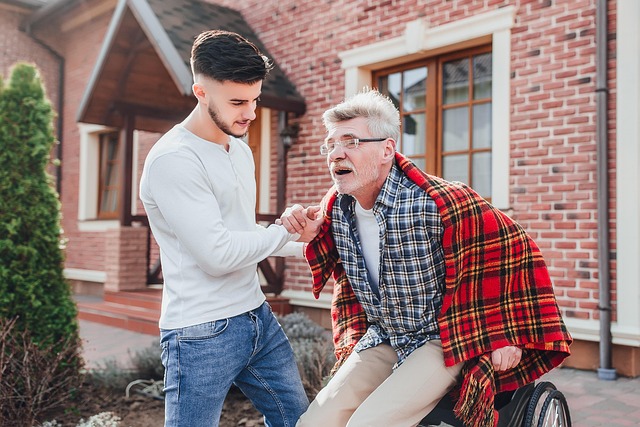 professional caregiver assisting elderly person with gentle support and reassurance