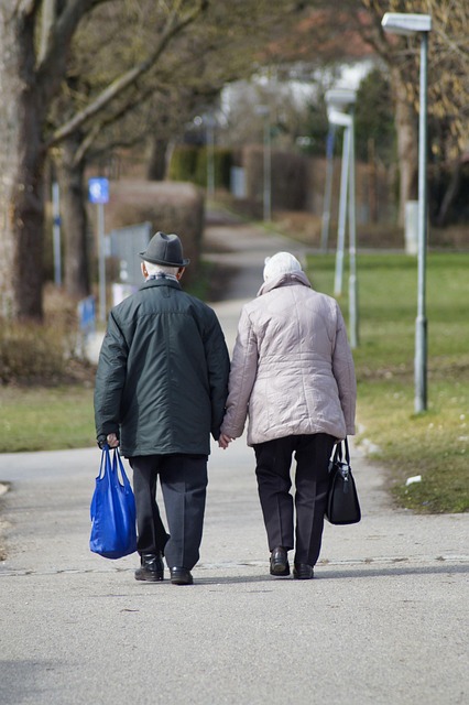 professional caregiver listening attentively to an older adult in a calm setting